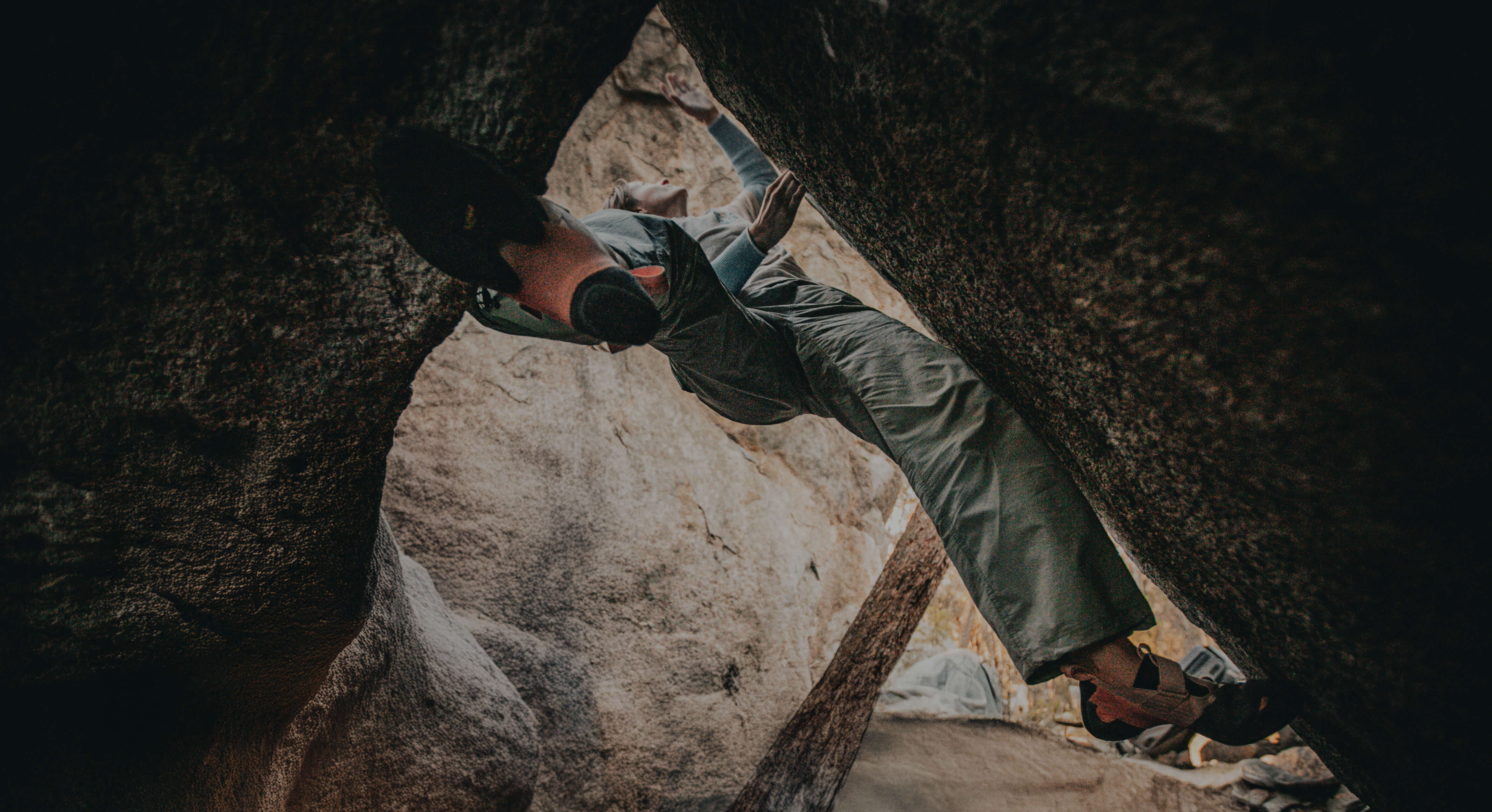 Climber bouldering in a dramatic rock overhang